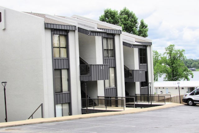 270 Lake Hamilton Dr Unit E-9, Hot Springs, AR 71913 - view of building exterior featuring uncovered parking