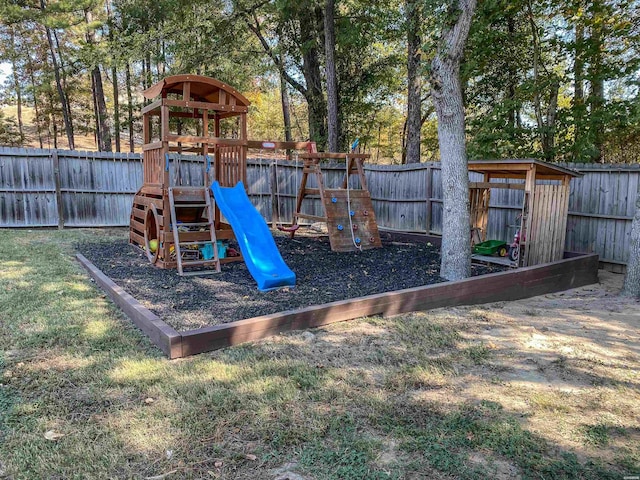 view of playground with a lawn and a fenced backyard