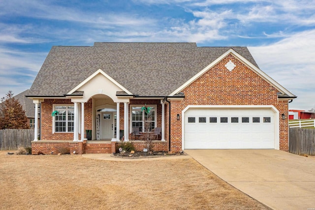 view of front of house with an attached garage, brick siding, fence, concrete driveway, and roof with shingles