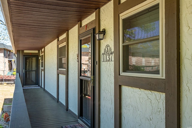 view of exterior entry with stucco siding