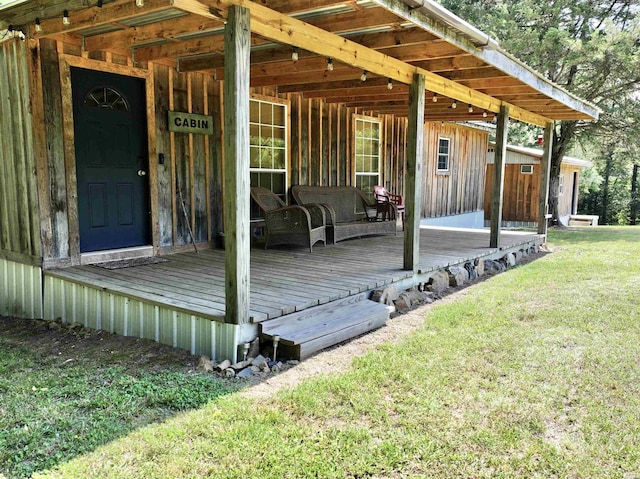 wooden terrace with a yard