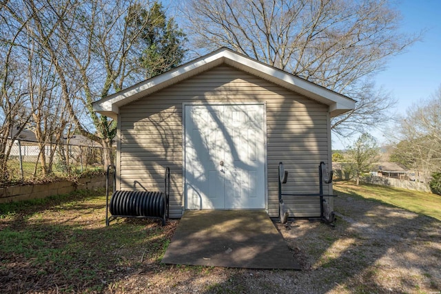 view of outdoor structure featuring an outdoor structure and fence