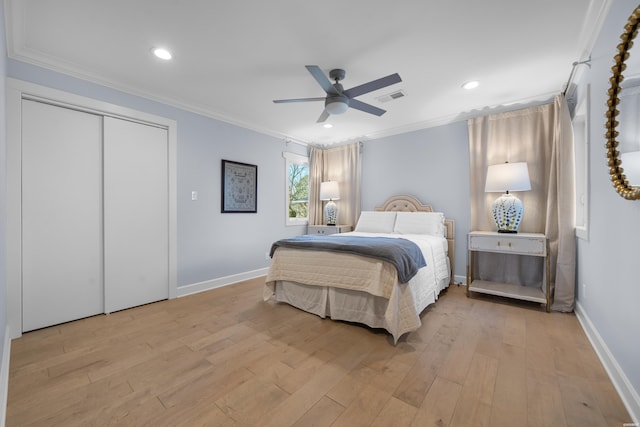 bedroom featuring crown molding, visible vents, and light wood-type flooring