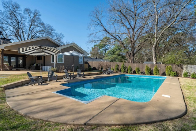 view of pool featuring a fenced in pool, a patio, and a fenced backyard