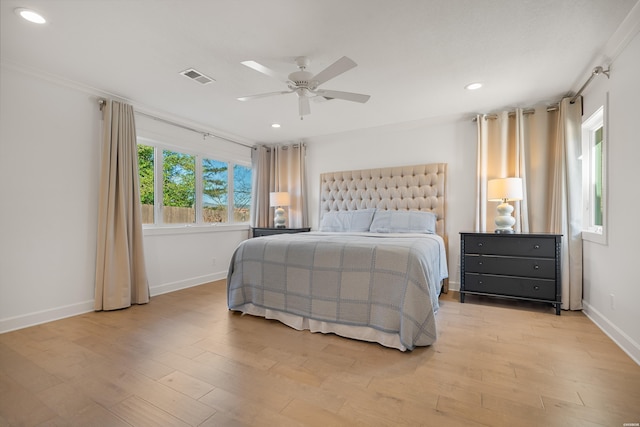 bedroom featuring visible vents, recessed lighting, light wood-type flooring, and baseboards