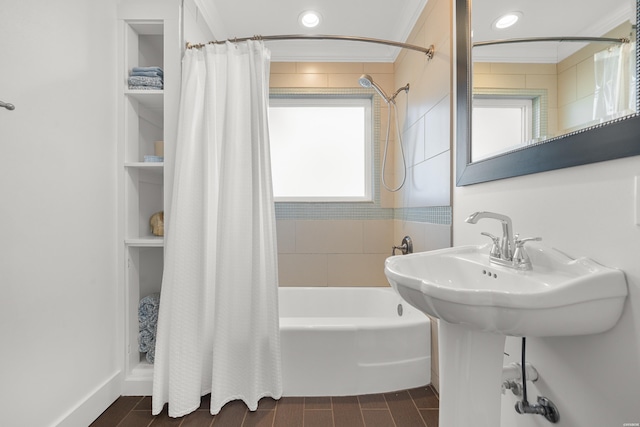 full bathroom featuring shower / bath combo with shower curtain and crown molding