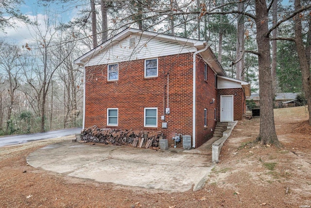 view of side of property with brick siding