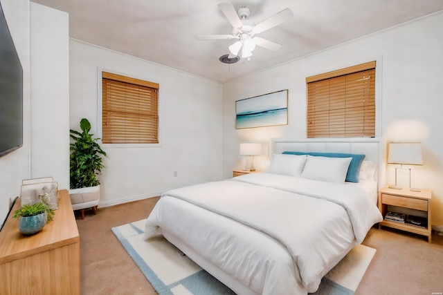 bedroom featuring light carpet and ceiling fan