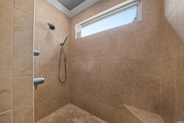 bathroom with a tile shower