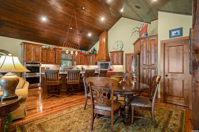 dining space featuring high vaulted ceiling, recessed lighting, wooden ceiling, and light wood-style floors