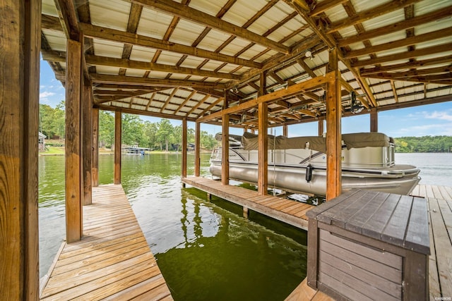 view of dock featuring a water view and boat lift