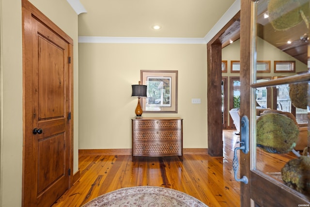 foyer entrance featuring recessed lighting, crown molding, baseboards, and hardwood / wood-style flooring