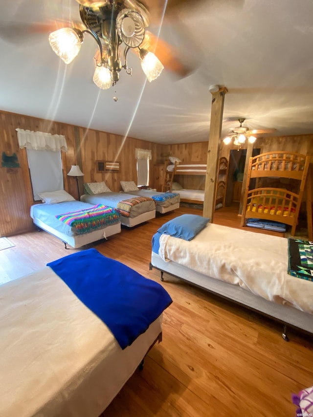 46 Hickory Hill Ln, Mount Ida, AR 71957 - bedroom featuring wood walls, ornate columns, and wood finished floors