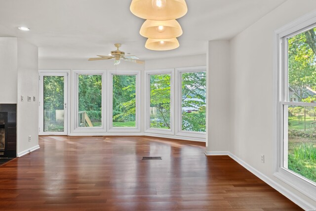 512 Beachview Cir, Hot Springs, AR 71913 - unfurnished living room with ceiling fan, wood finished floors, and a tile fireplace