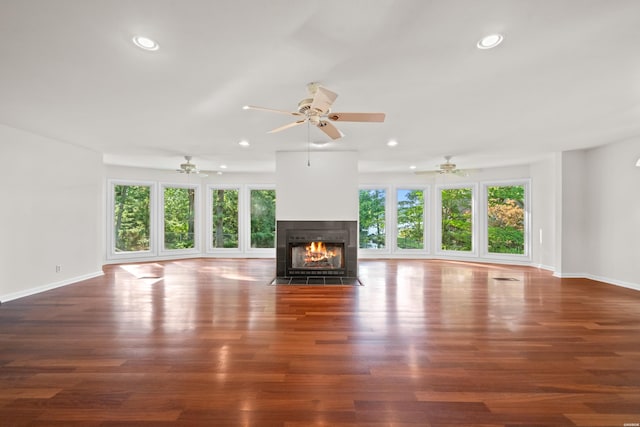 512 Beachview Cir, Hot Springs, AR 71913 - unfurnished living room featuring plenty of natural light, recessed lighting, a fireplace with flush hearth, and wood finished floors