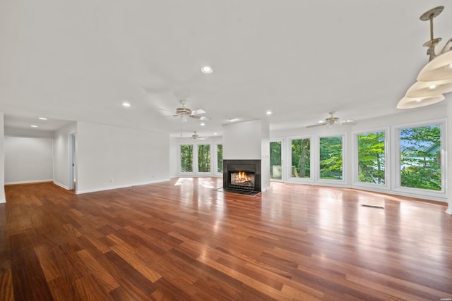 512 Beachview Cir, Hot Springs, AR 71913 - unfurnished living room featuring ceiling fan, a fireplace with flush hearth, wood finished floors, and recessed lighting
