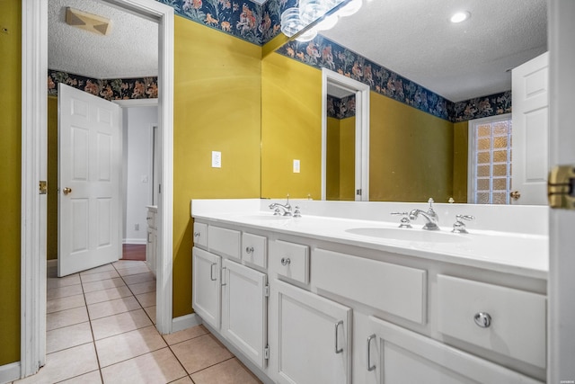 512 Beachview Cir, Hot Springs, AR 71913 - full bath with a textured ceiling, double vanity, tile patterned flooring, and wallpapered walls
