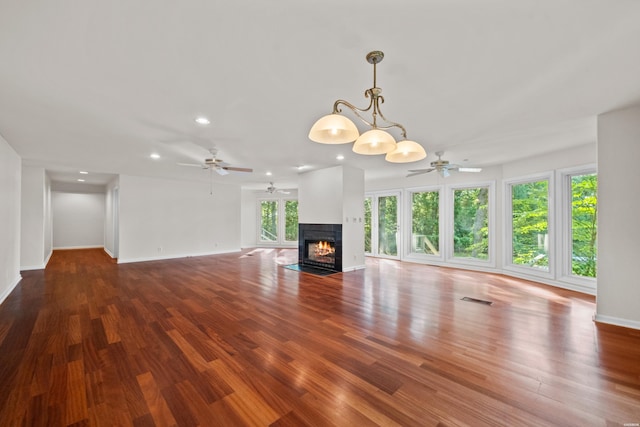 512 Beachview Cir, Hot Springs, AR 71913 - unfurnished living room featuring ceiling fan, a fireplace with flush hearth, recessed lighting, and wood finished floors