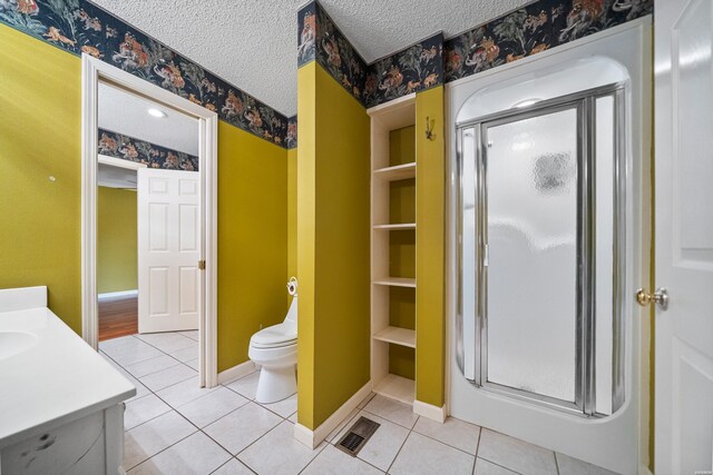 512 Beachview Cir, Hot Springs, AR 71913 - full bath with vanity, a stall shower, tile patterned flooring, and a textured ceiling