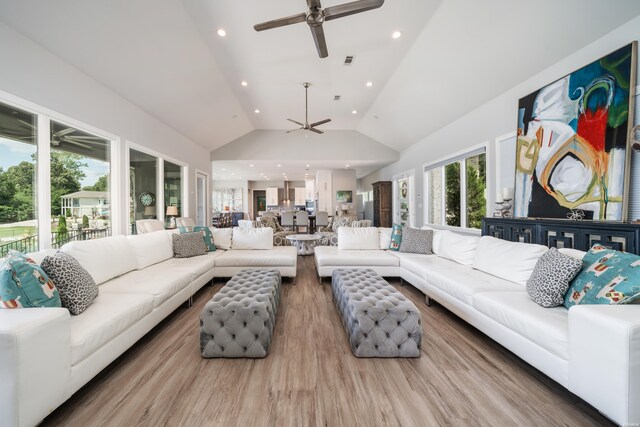 living area featuring ceiling fan, high vaulted ceiling, recessed lighting, wood finished floors, and visible vents