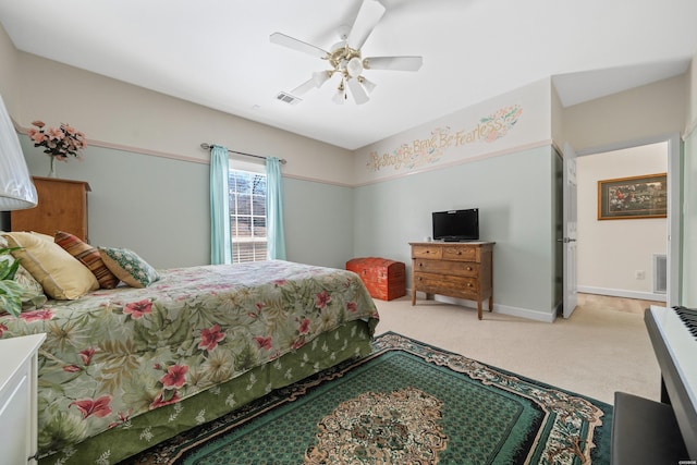 bedroom with baseboards, ceiling fan, visible vents, and light colored carpet