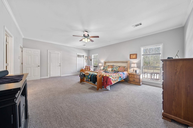 bedroom with carpet floors, visible vents, ornamental molding, a ceiling fan, and baseboards