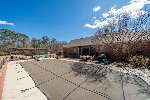 view of swimming pool featuring a patio