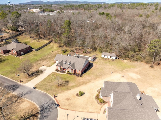 bird's eye view with a mountain view and a view of trees