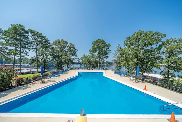 pool featuring a patio and fence