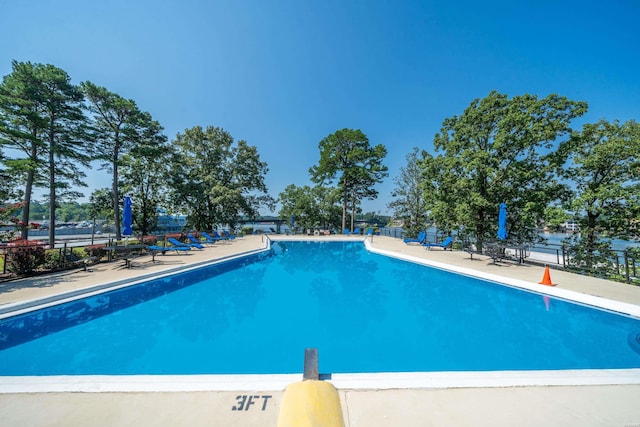community pool featuring fence