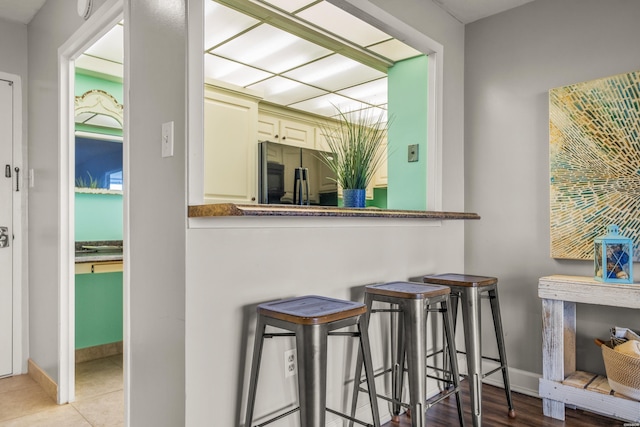 740 Weston Rd Unit 810-B, Hot Springs, AR 71913 - bar with black refrigerator and baseboards