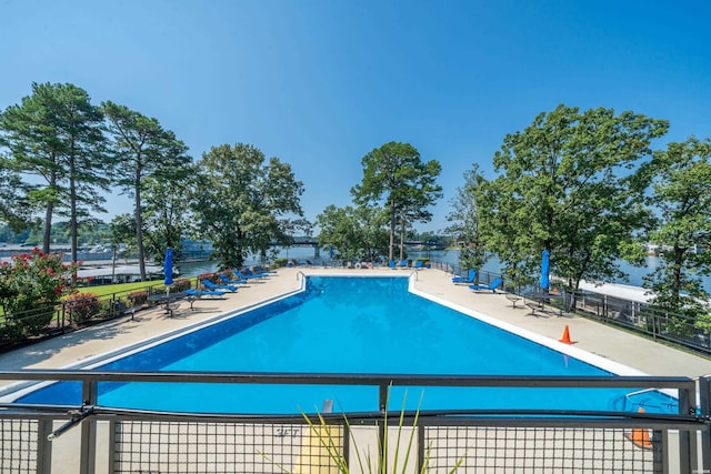pool with fence and a patio area