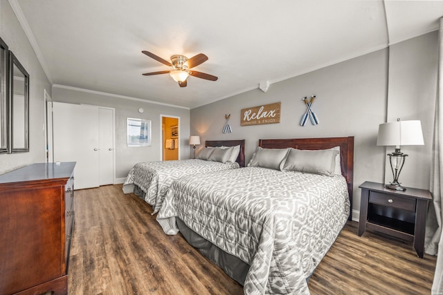 bedroom with ceiling fan, crown molding, and dark wood finished floors