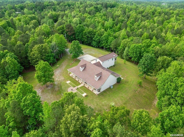 bird's eye view featuring a wooded view