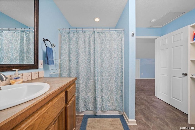 bathroom featuring vanity and a shower with shower curtain