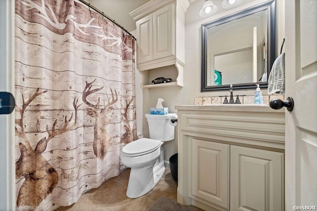 full bath with tile patterned flooring, vanity, and toilet