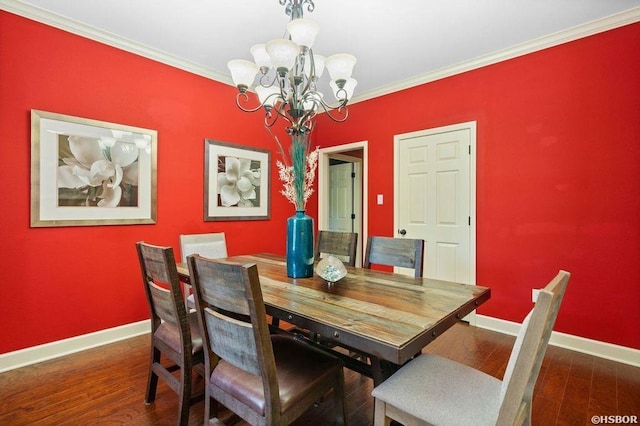 dining space featuring baseboards, ornamental molding, dark wood-style flooring, and a notable chandelier