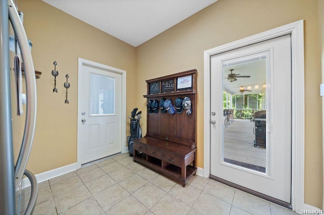 mudroom with baseboards and light tile patterned floors