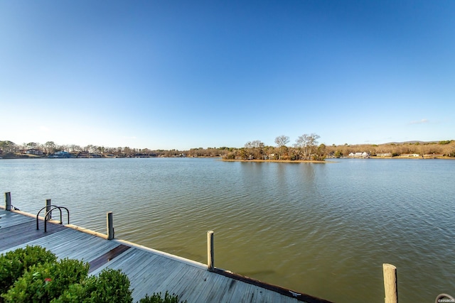 view of dock with a water view