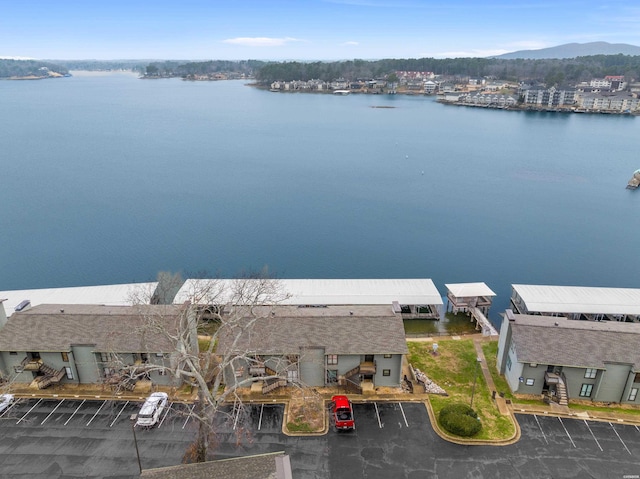 birds eye view of property with a water view