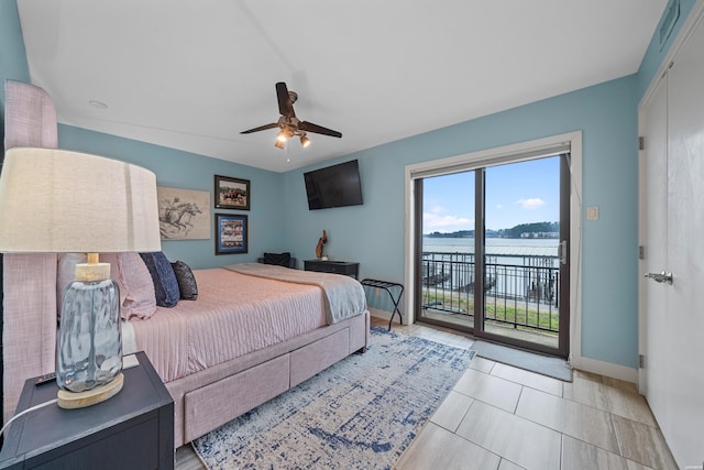 bedroom with access to exterior, ceiling fan, baseboards, and light tile patterned floors