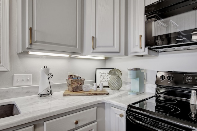 532 Grand Point Dr Unit C1, Hot Springs, AR 71901 - kitchen with white cabinetry, black appliances, and light stone countertops