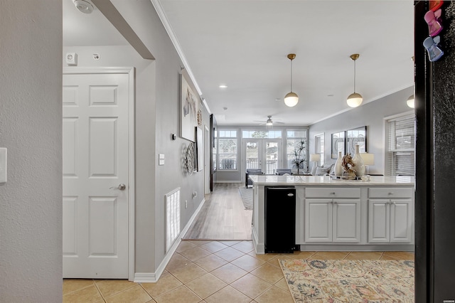 532 Grand Point Dr Unit C1, Hot Springs, AR 71901 - kitchen with hanging light fixtures, light countertops, freestanding refrigerator, ceiling fan, and light tile patterned flooring