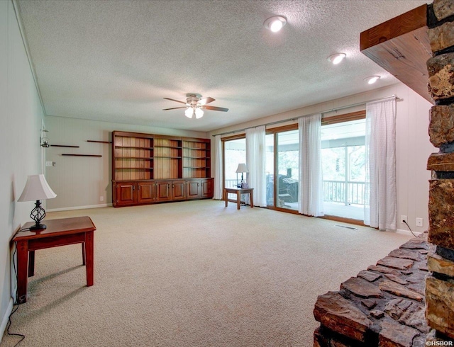 7 Sonora Way, Hot Springs Village, AR 71909 - living area with ceiling fan, a textured ceiling, and light colored carpet