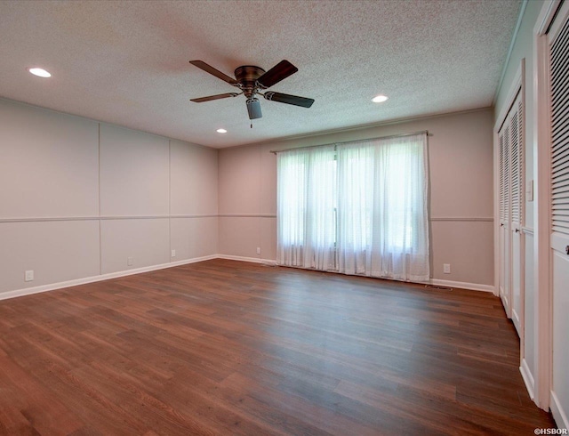 7 Sonora Way, Hot Springs Village, AR 71909 - unfurnished bedroom featuring dark wood-type flooring, a textured ceiling, recessed lighting, ceiling fan, and two closets
