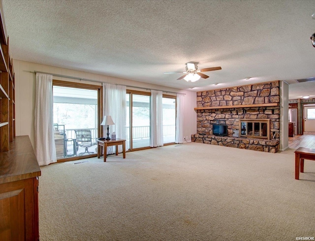 7 Sonora Way, Hot Springs Village, AR 71909 - living room featuring carpet floors, a fireplace, ceiling fan, and a textured ceiling