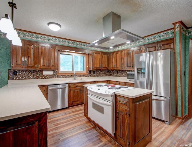 7 Sonora Way, Hot Springs Village, AR 71909 - kitchen featuring appliances with stainless steel finishes, island exhaust hood, a textured ceiling, light wood-type flooring, and light countertops