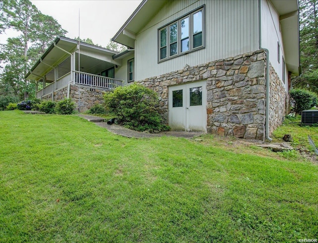 7 Sonora Way, Hot Springs Village, AR 71909 - view of property exterior featuring stone siding and a lawn
