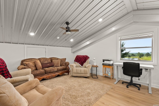 living area with recessed lighting, baseboards, lofted ceiling, and light wood-style floors