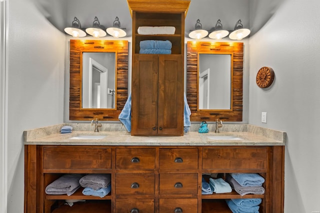 bathroom featuring double vanity and a sink